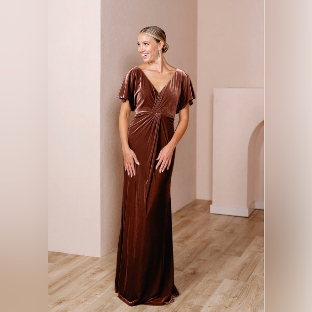 Brand new with tags, never worn. Size 2, maxi length.